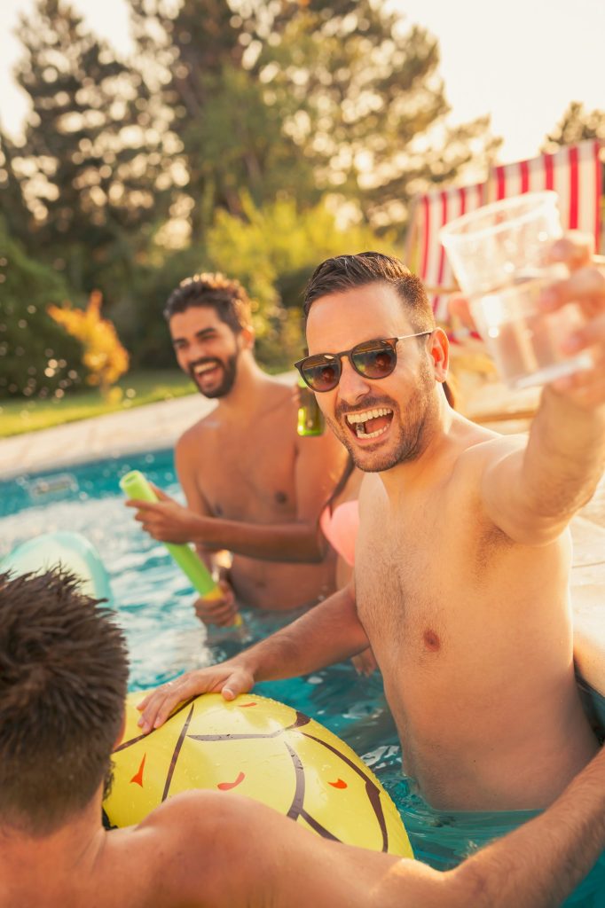 Friends having fun at a swimming pool party Friends having fun at a swimming pool party
